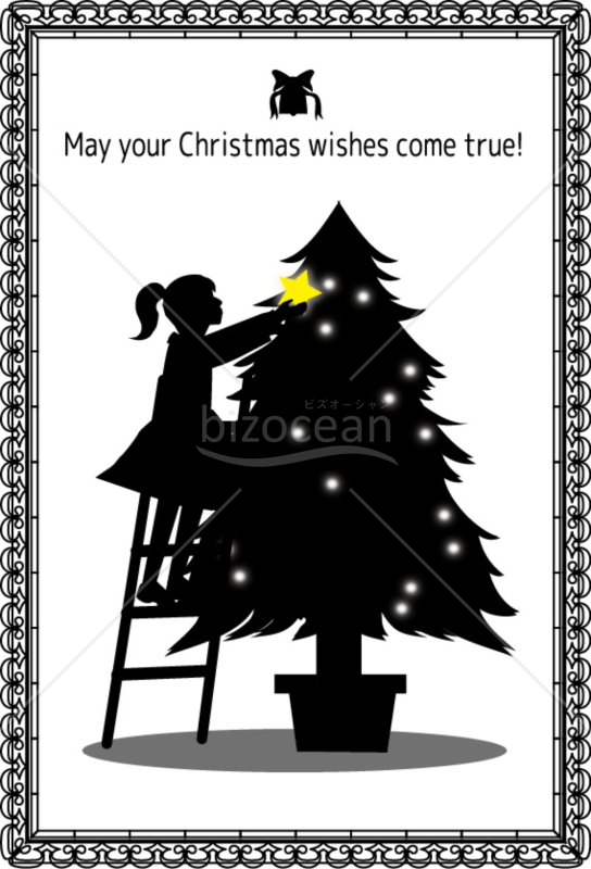 ツリーの上に星のオーナメントを飾る女の子のクリスマスカード